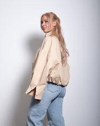 SEISHIKI STUDIO cropped high neck oversized windbreaker jacket beige