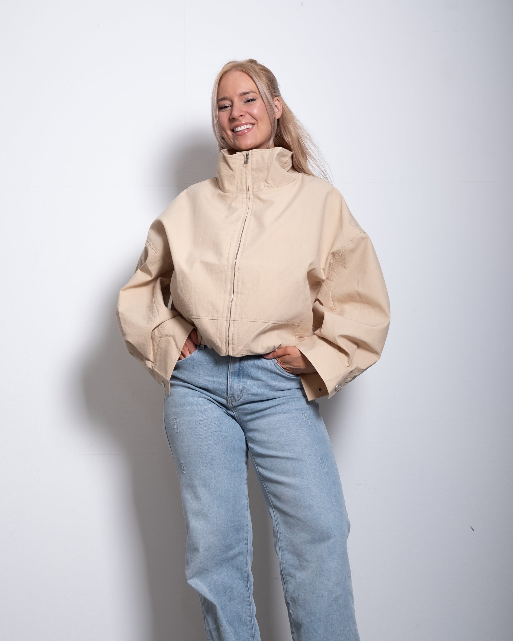 SEISHIKI STUDIO cropped high neck oversized windbreaker jacket beige