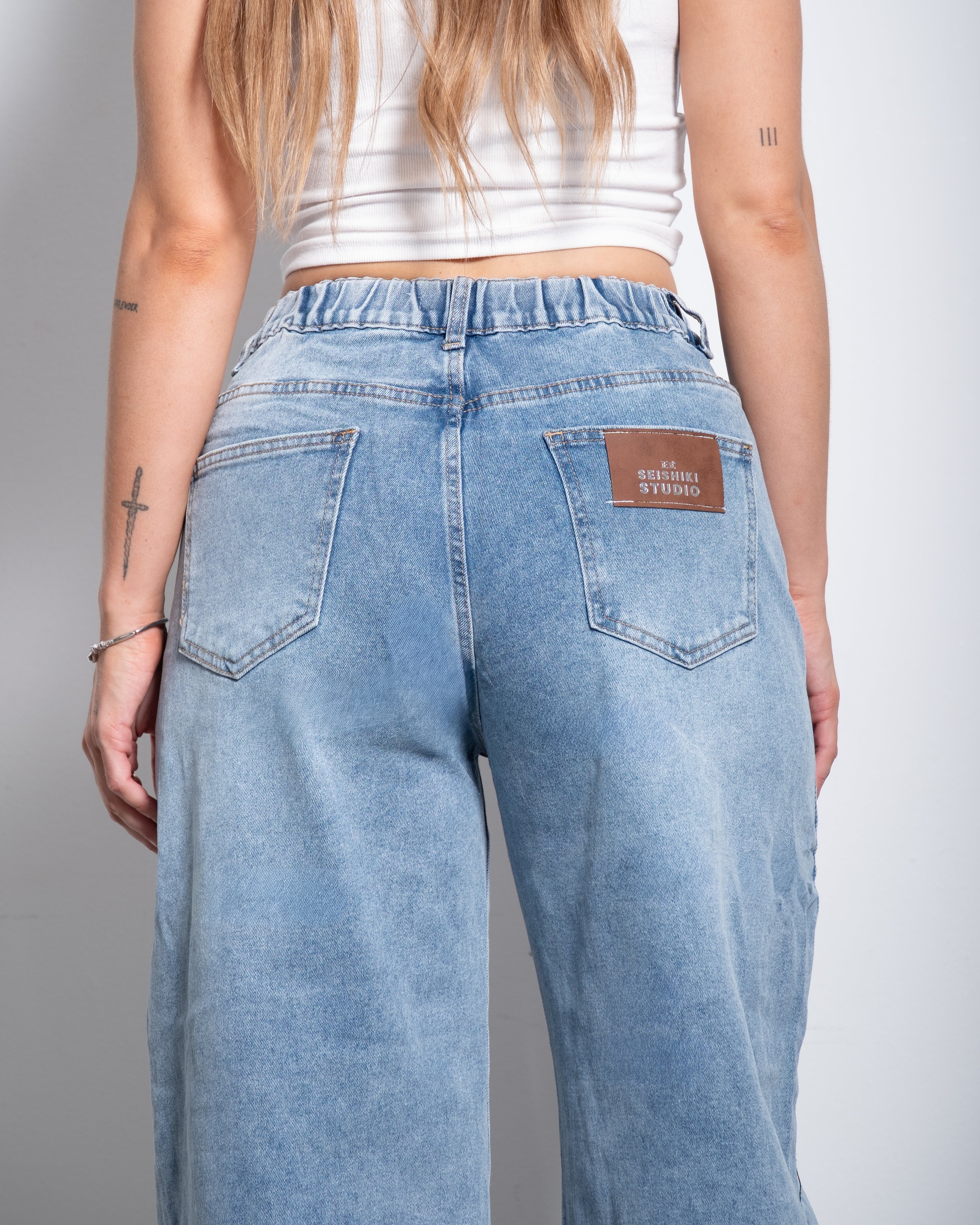 Medium Wash With Stretchy Back Balloon Jeans With Brown Patch  | SEISHIKI STUDIO